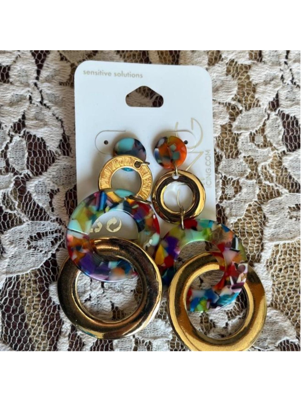 Multi-colored acrylic earrings with gold accents and colorful marbled design #st